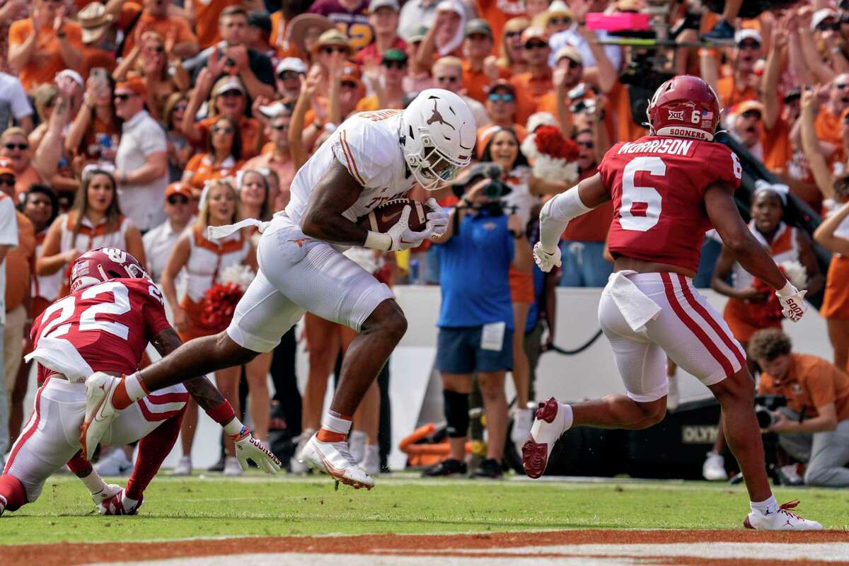 Tight end Ja'Tavion Sanders scores against Oklahoma in Texas’ 49-0 victory that avenges last year’s loss to the Sooners and leaves the Longhorns 2-0 in such games with four more to come.