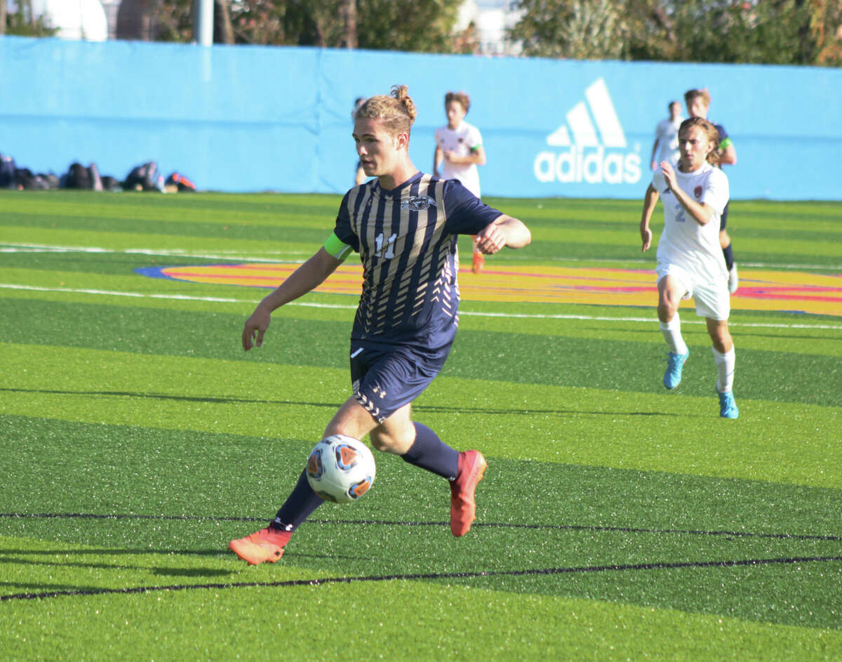 Owen Terrell dribbles against Roxana on Wednesday in the Class 1A Roxana Regional semifinal. Terrell scored one goal and assisted on three goals in the 7-1 Father McGivney win. 