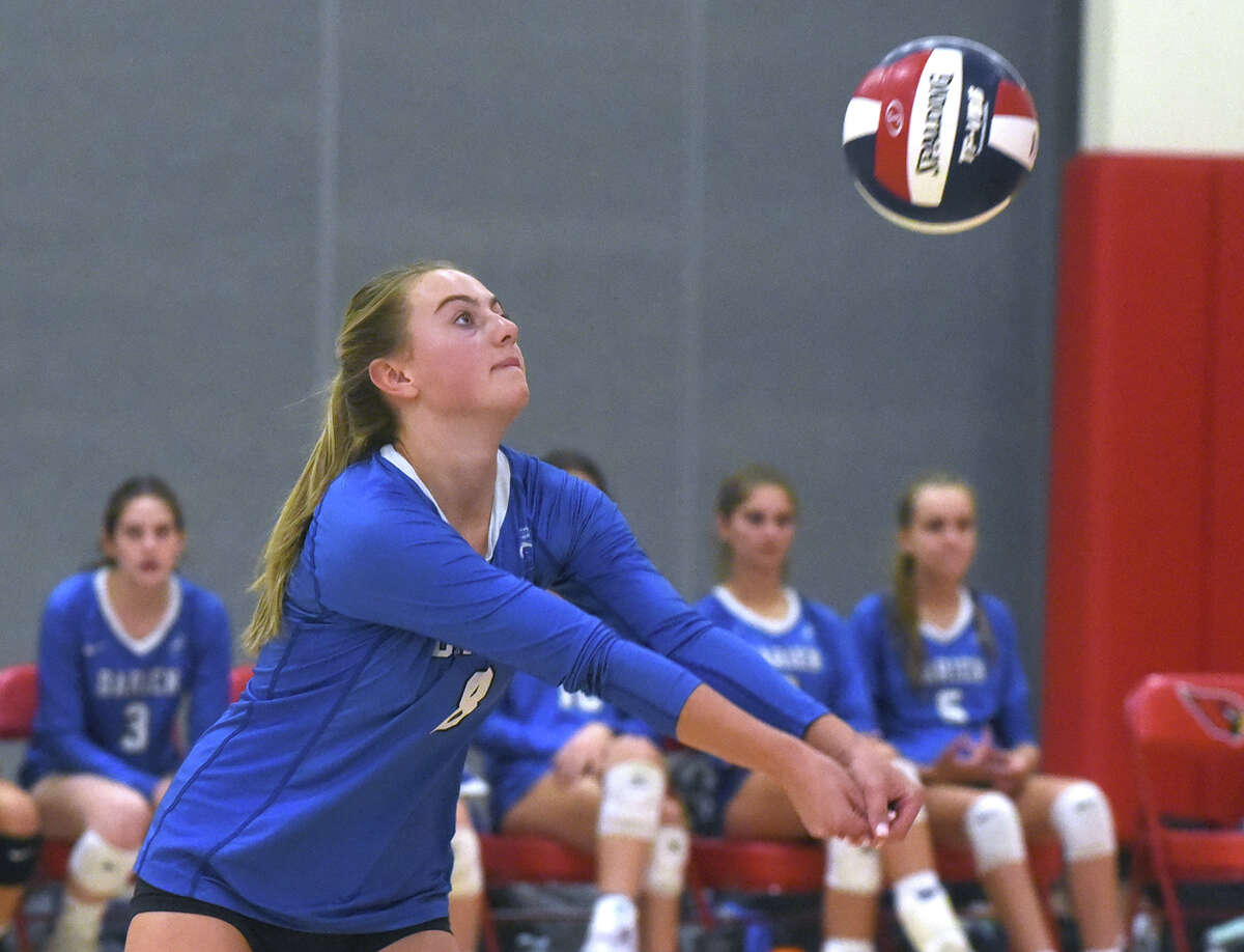 Darien's Aubrey Moore (8) passes the ball during a girls volleyball match in Greenwich on Wednesday, Oct. 12, 2022.