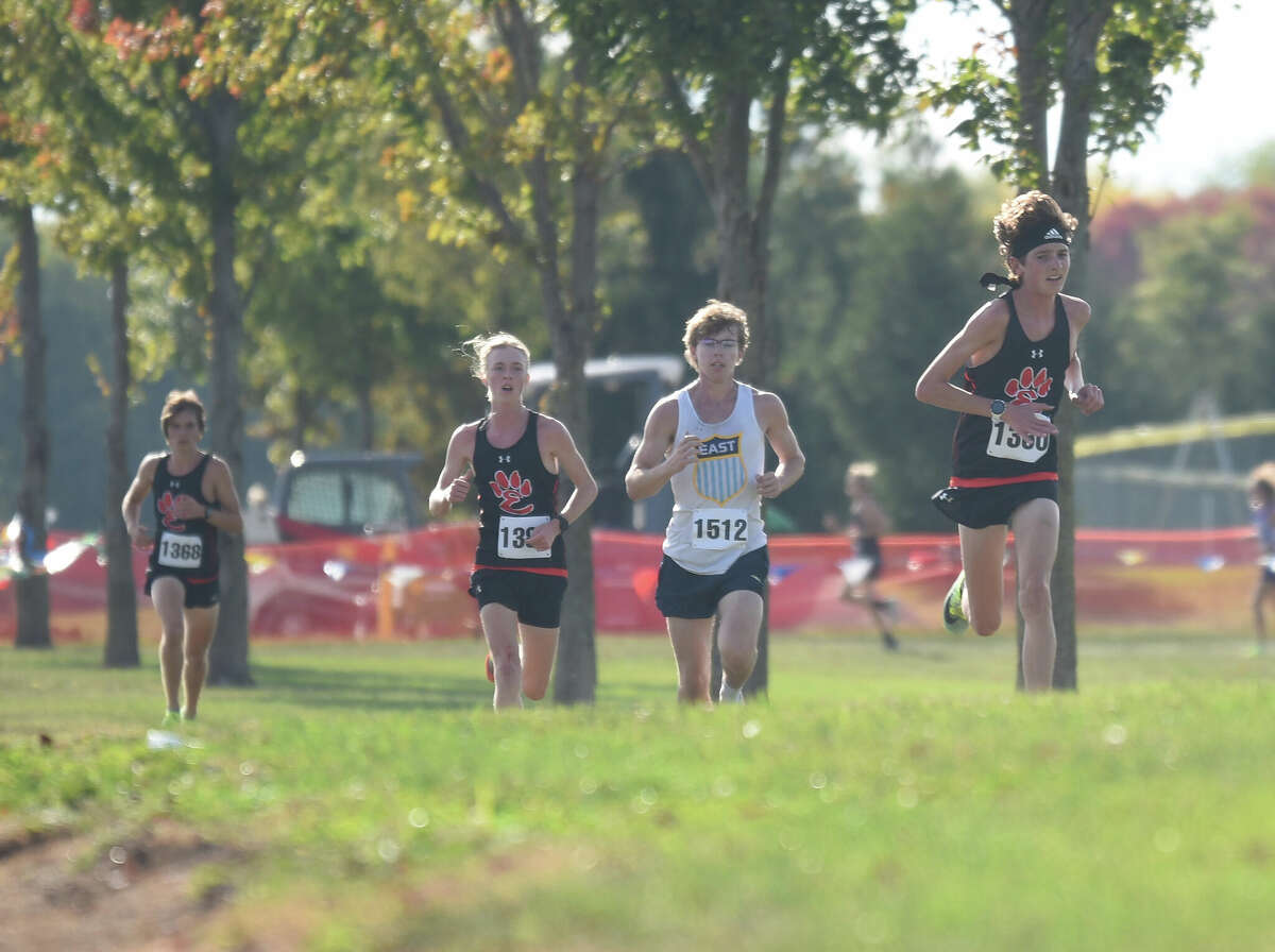 Edwardsville's Jackson Amick, front, competes during the Southwestern Conference Meet on Wednesday in O'Fallon.