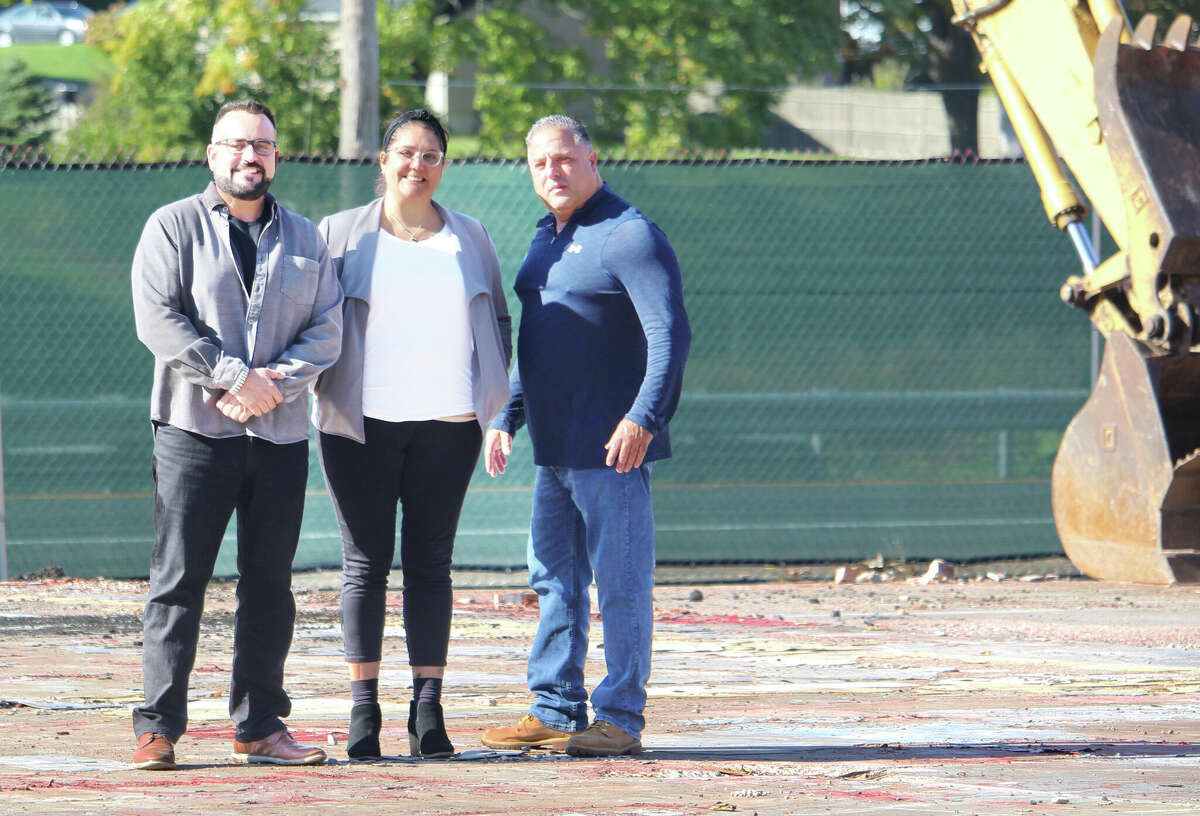 From left, Middletown developer Dominick DeMartino, Acting Director of Economic and Community Development Bobbye Knoll Peterson and Dairy Queen property and franchisee John DeSena gather at the future site of the fast-food chain at 562 S. Main St. 