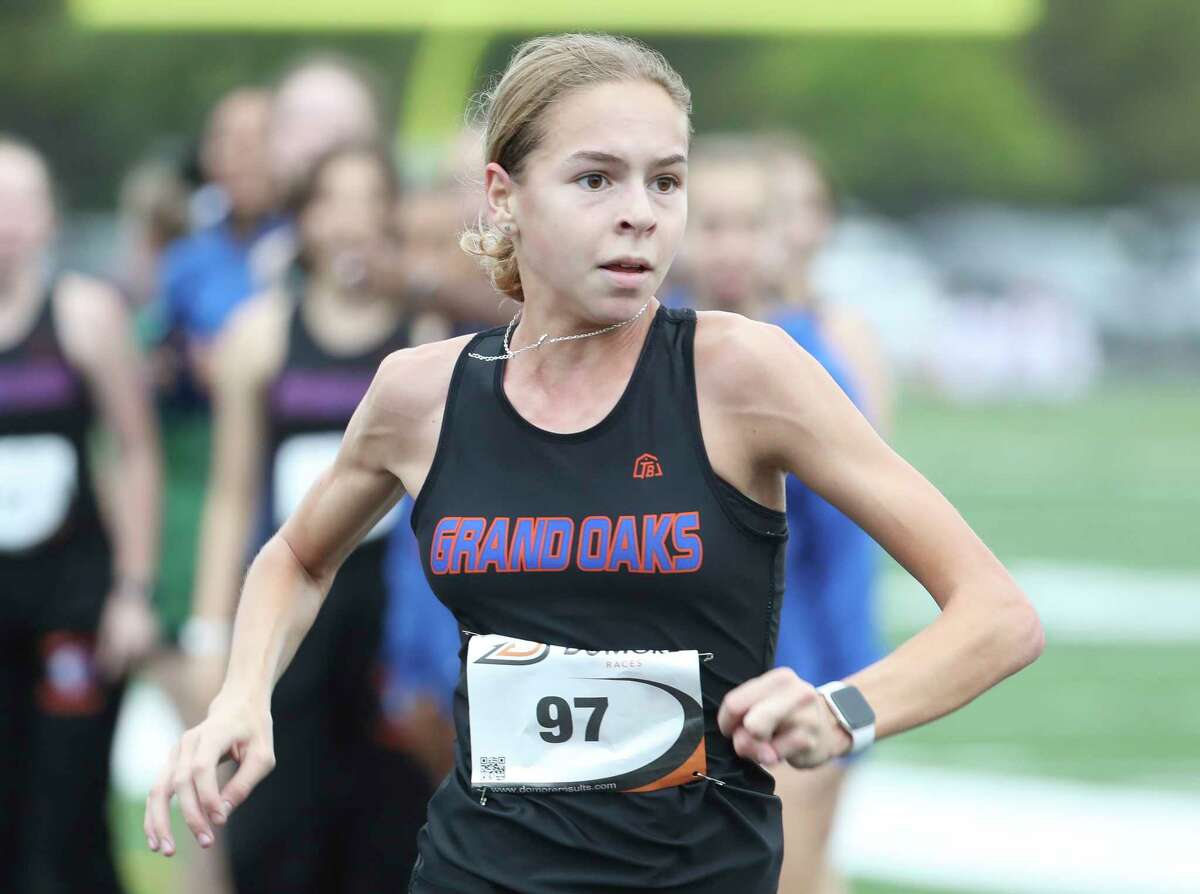 Grand Oaks’ Staucie Lees competes during the District 13-6A cross country meet at College Park High School, Thursday, Oct. 13, 2022, in The Woodlands.
