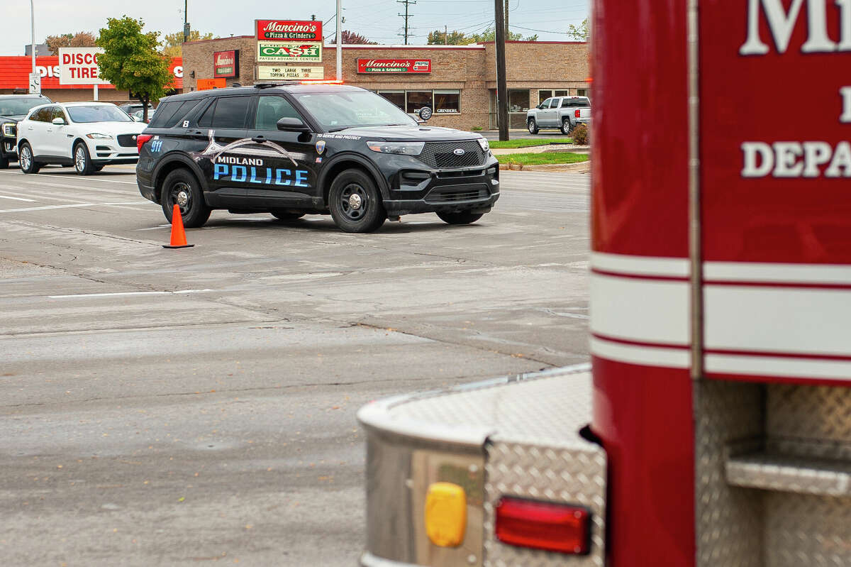 The Midland police and fire departments respond to a vehicle crash on Oct. 12, 2022 in the area of South Saginaw Road and Rodd Street.
