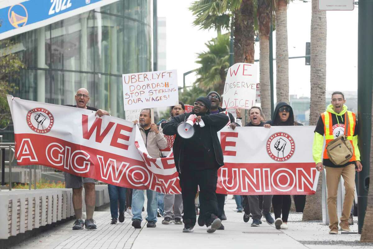Members of the California Gig Workers Union march up San Francisco’s Third Street during a California Gig Workers Union demonstration on Wednesday.