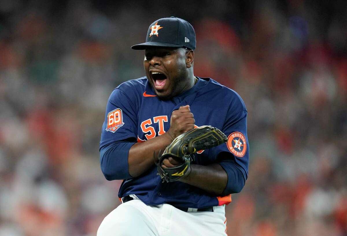 Houston Astros relief pitcher Héctor Neris (50) reacts after getting Seattle Mariners Cal Raleigh (29) to ground out with the bases loaded in the sixth inning during Game 2 of the American League Division Series at Minute Maid Park on Thursday, Oct. 13, 2022, in Houston.