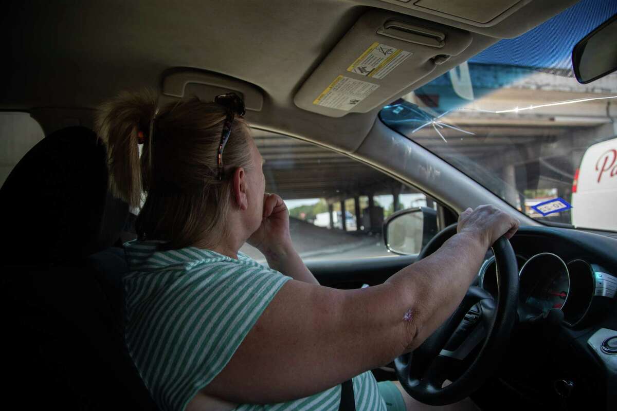Luba Boemmel looks for her son under the usual bridges he frequents on Sept. 12, 2022, in Houston. Boemmel is a truck driver living in Alabama, and she travels to Houston in between hauls to search for him.