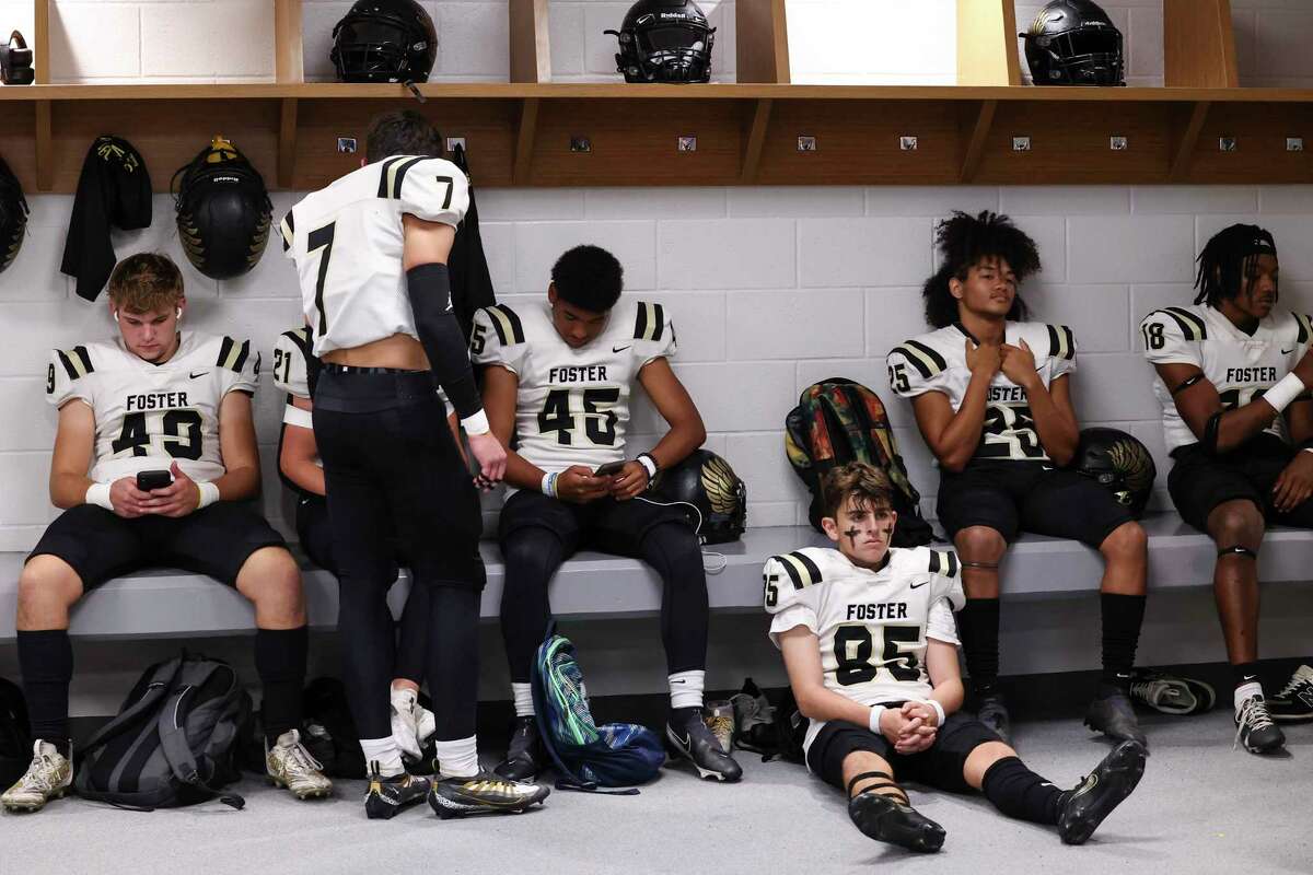 Foster players Griffin Vickery (49), Brayden McFadden (45), Nicholas Lopez (85), Joshua Amy (25) & Matthew Ferguson (18) wait in the locker room during a lightning delay at a District 10-5A Division I high school football game between the Foster Falcons and the Manvel Mavericks at Freedom Field in Rosharon, TX on Thursday, October 13, 2022.
