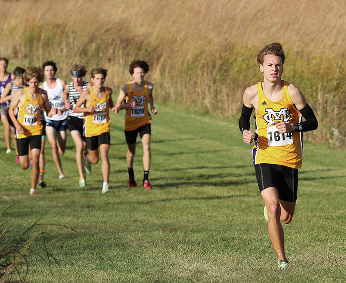 CM senior Jackson Collman (right) leads teammates (from left) Justice Eldridge, D.J. Dutton and Lucas Naugle in the opening half of the MVC Meet on Thursday at Principia College in Elsah.