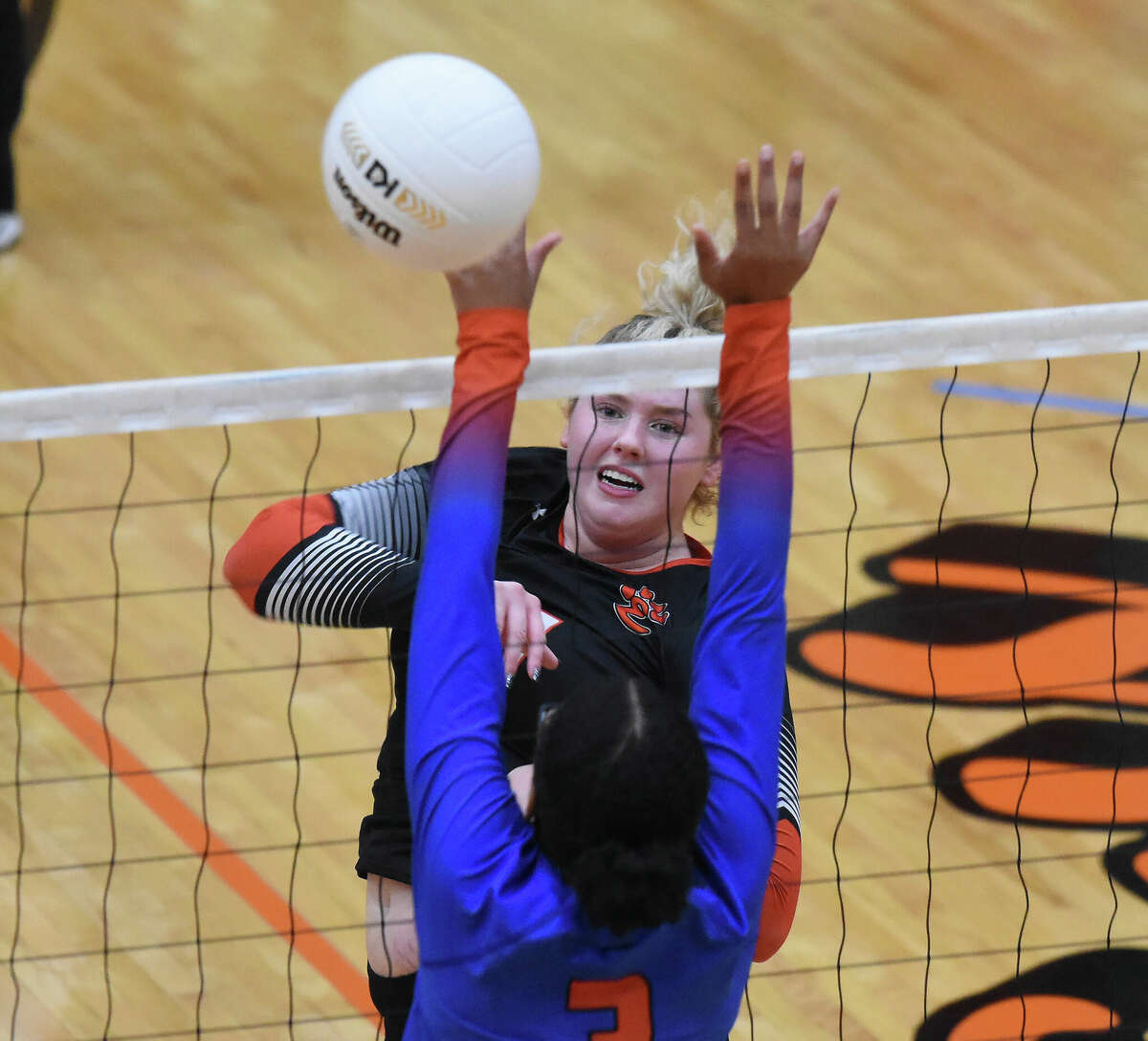 Edwardsville's Claire Dunivan goes up for an attack against East St. Louis on Thursday inside Lucco-Jackson Gymnasium in Edwardsville.