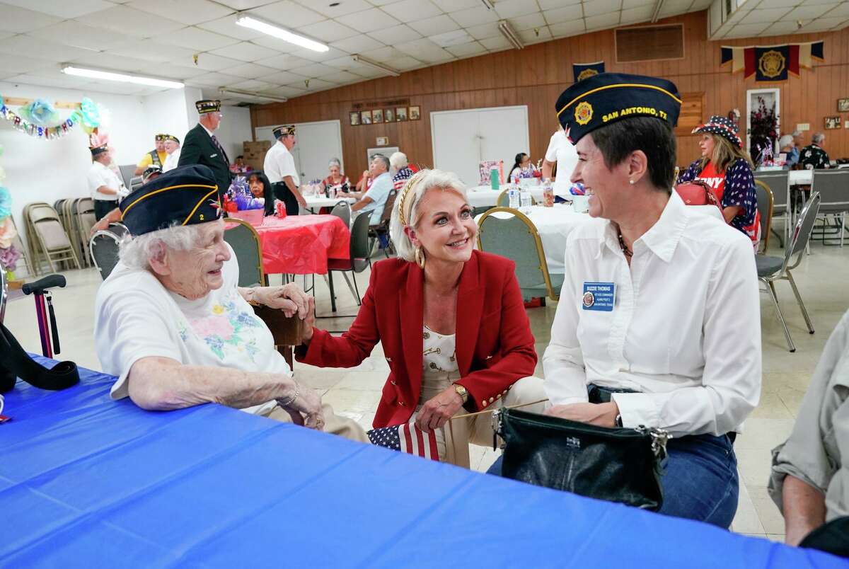 Trish DeBerry talks with Pat Farrell (left) and Suzie Thomas during a 9/11 event at the American Legion Post No. 2 as she campaigned in September for the position of Bexar County judge. A reader writes that campaigning is not allowed in the Legion’s bylaws.