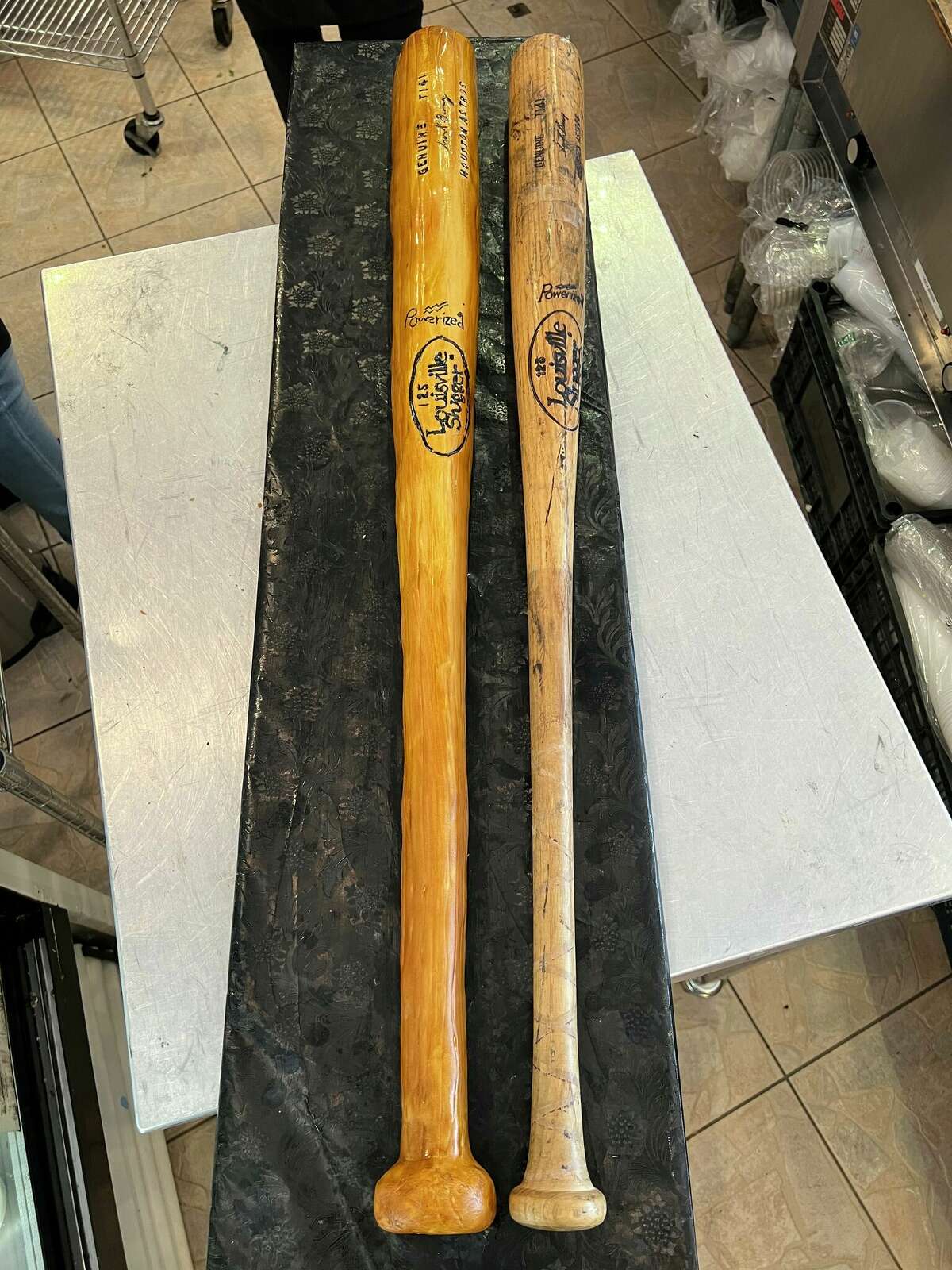 A customer requested Rustika Café and Bakery create a cake replica of a Houston Astros baseball bat for a private event in or near Friendswood.