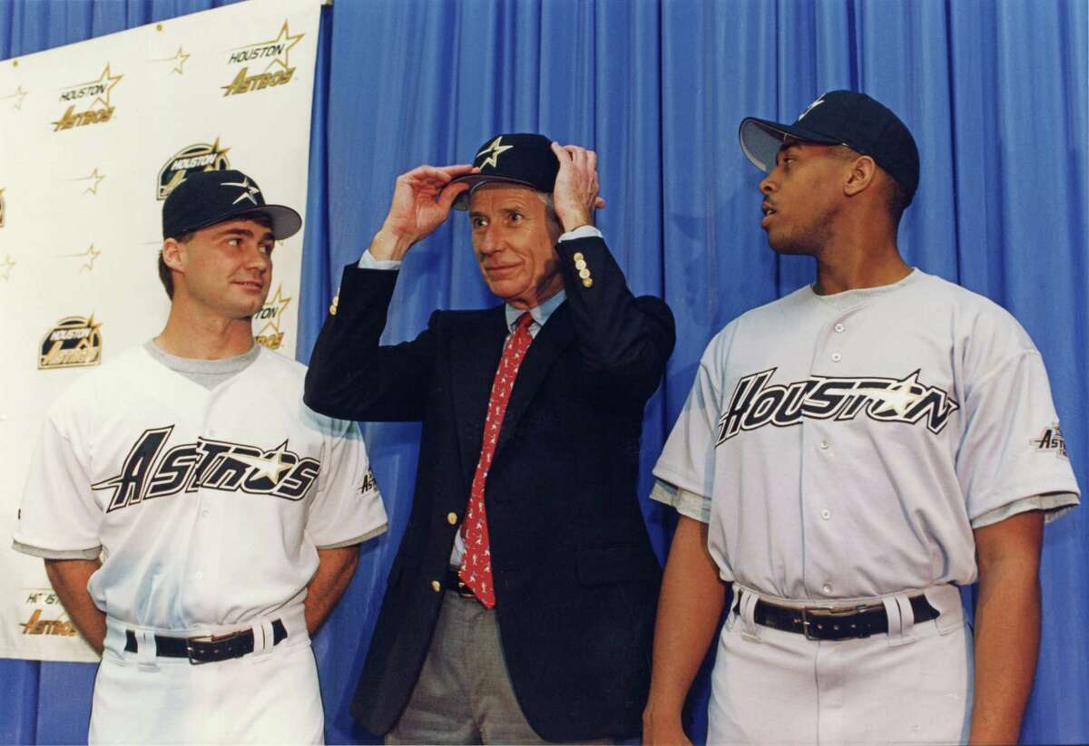 A young Scott Servais (left) models the new Astros uniforms unveiled in February 1994 with then-owner Drayton McLane and pitcher Brian Williams. Servais, now managing the Mariners against the Astros in the ALDS, played in Houston from 1991-95 and 2001.