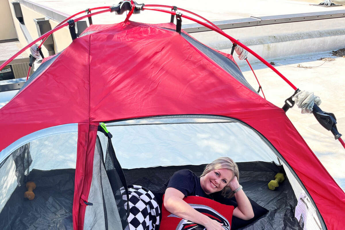 Story photo for Huffman principal spends the night on rooftop after losing a bet to her students.