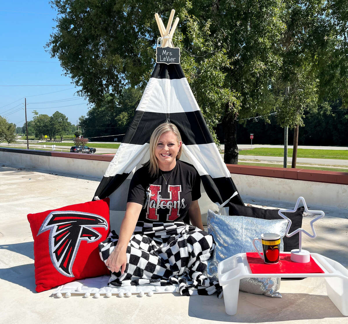 Huffman Elementary principal Angie LeVier was set to spend the night on the rooftop after losing a bet with her students. She took with her a tent, pillows, snacks, flashlight, blankets, lantern, phone and laptop to work while she enjoyed a completely different view.