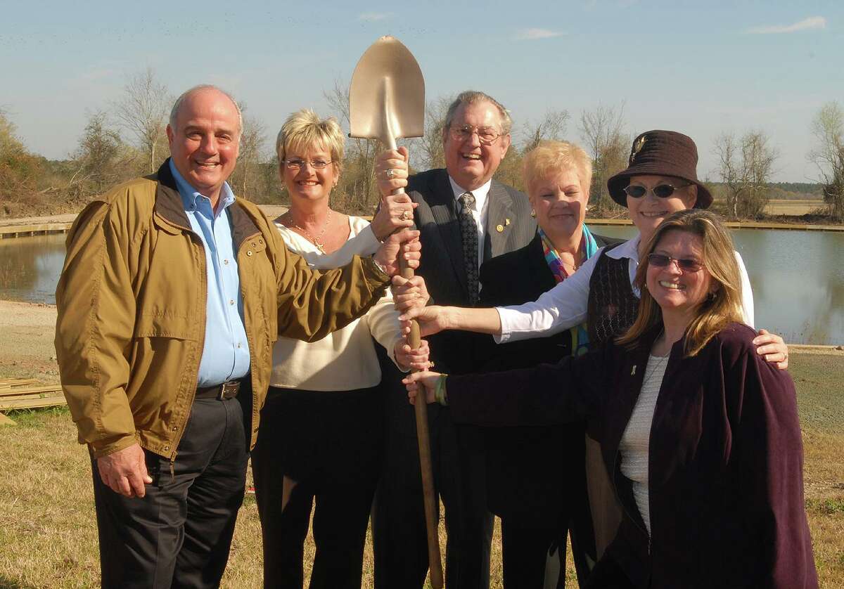 Precinct 1 Commissioner Mike Meador, Corliss O'Shaugnessy, Rotary District Gov. Jack McCollough, Jerilynn Williams, Montgomery County Memorial Library System director, and Beverly Christopher and Kris McBride gather for the groundbreaking ceremony for Memory Park at Charles B. Stewart West Branch Library in Montgomery. The Rotary Club of Lake Conroe recently celebrated the history of Memory Park.