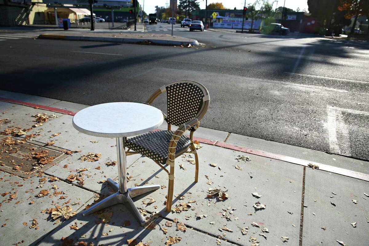 Empty table and chair at Crema on The Alameda in San Jose, Calif.