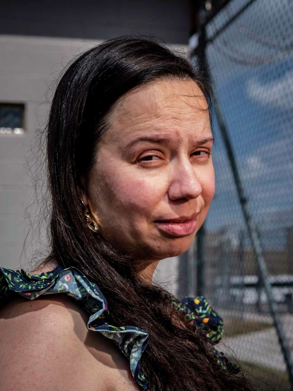Amy Kamp, who has been advocating for inmates at the Hays County Jail who remain incarcerated for extended periods of time without having been convicted of a crime, poses for a portrait outside the jail Friday, Oct. 14, 2022, in San Marcos.