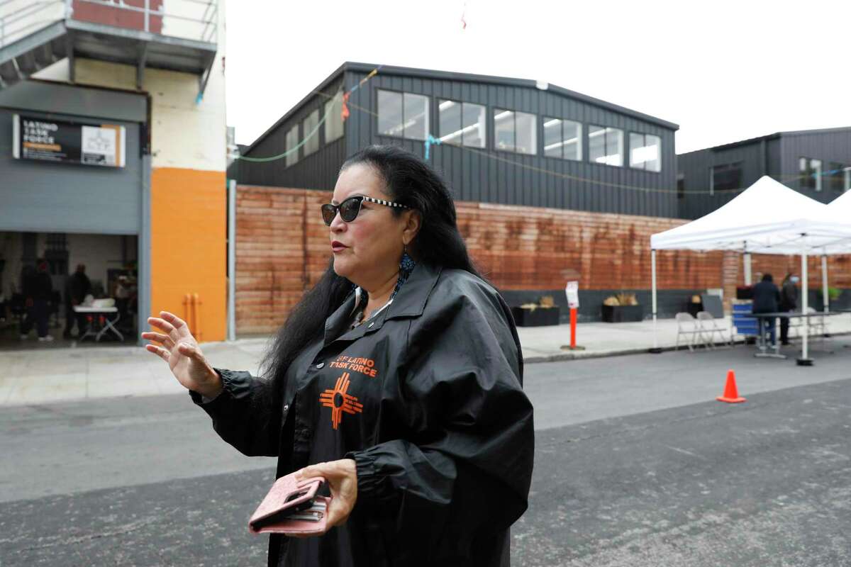 Valerie Tulier-Laiwa, co-founder of the Latino Task Force, stands outside the Mission Hub on Alabama Street in San Francisco as the COVID clinic and resource center opens to guests on Thursday, Oct. 13, 2022.