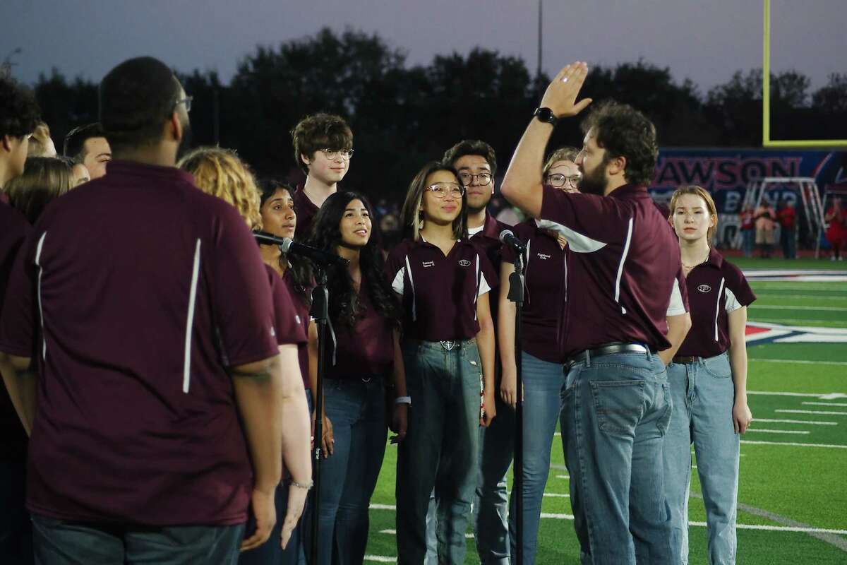 The Pearland High School Kantorei choir performs the National Anthem before the game between Pearland and Dawson Friday, Oct. 14, 2022 at The Rig in Pearland.