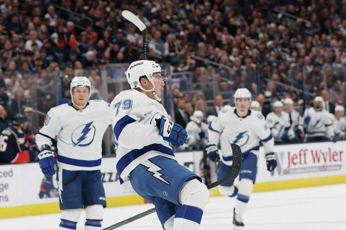 Lightning center Ross Colton (center) celebrates his goal during Tampa Bay’s 5-2 victory over Columbus. The Lightning moved to 1-1 on the season.