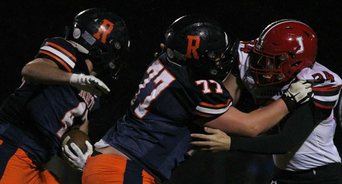 Jacksonville's Griffin Martin tries to fight through a block during a football game at Rochester Friday night.