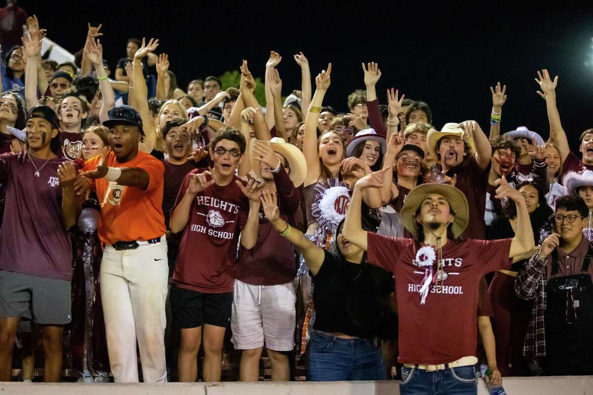 The Heights student section celebrates after the Rainey touchdown in a high school football game between Heights and Westside Friday, Oct 14, 2022, in Houston.