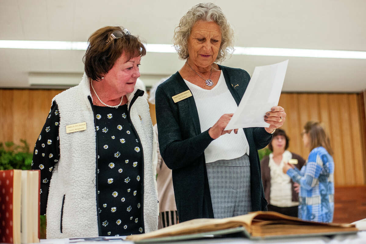 Members of the Midland Chapter of P.E.O. look through old memories at the group's 70th Anniversary Celebration on Oct. 13, 2022 at the Midland First United Methodist Church.