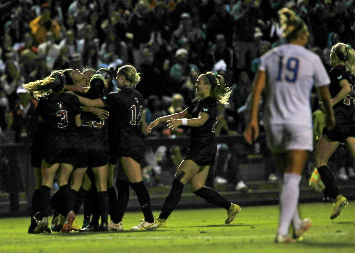 The Stanford women’s soccer team celebrate scoring a goal near the end of the first half against UCLA at Maloney Field at Cagan Stadium on Friday, October 14, 2022, in Stanford, Calif.