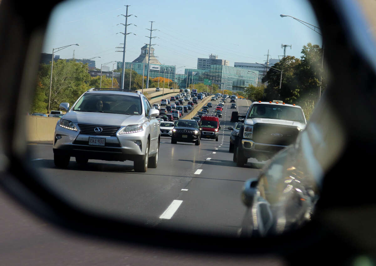 A view of Interstate 95 looking in the driver's side mirror of downtown Stamford, Conn., on Saturday October 15, 2022. The stretch of I-95 South from Westport to Greenwich ranked as the most congested corridor in the United States. The same section northbound ranked as No. 3.