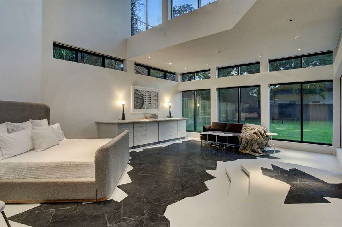 The master bedroom has a mezzanine overlooking it