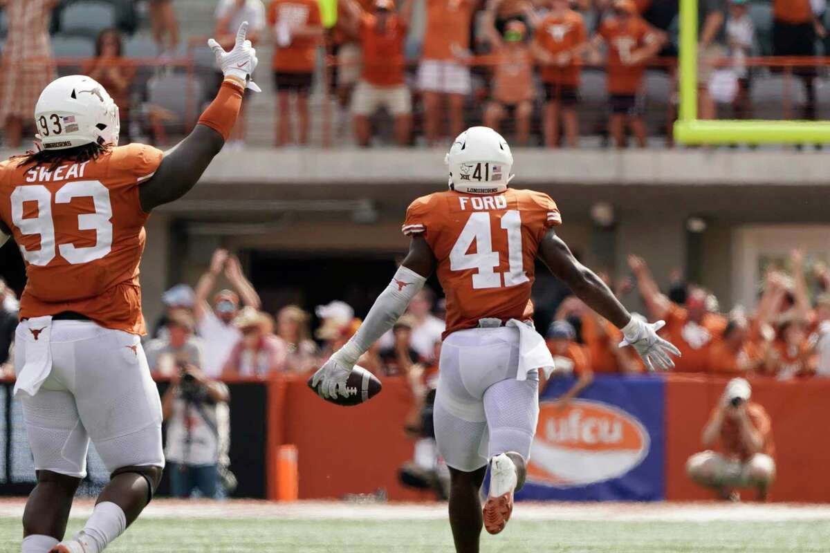 Texas linebacker Jaylan Ford (41) celebrates after he recovered an Iowa State fumble late in the second half of an NCAA college football game, Saturday, Oct. 15, 2022, in Austin, Texas. (AP Photo/Eric Gay)
