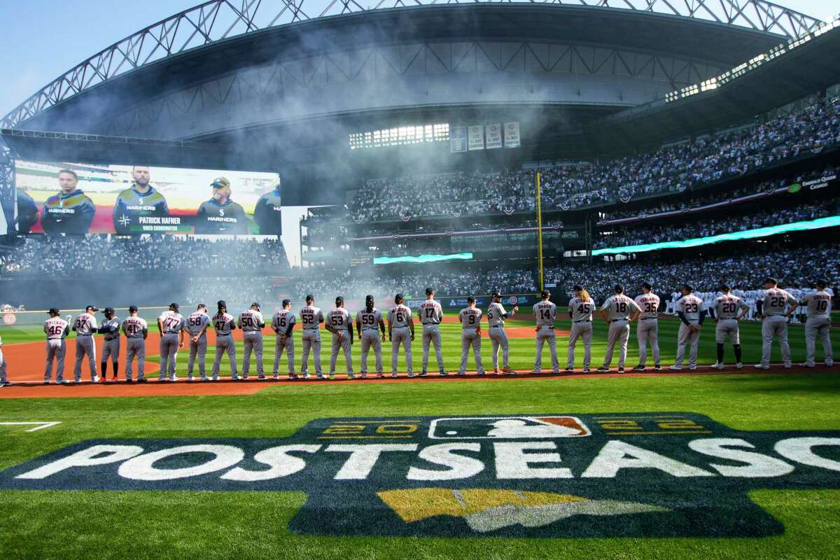 Houston Astros players line up after being introduced before Game 3 of the American League Division Series against the Seattle Mariners on Saturday, Oct. 15, 2022, in Seattle.