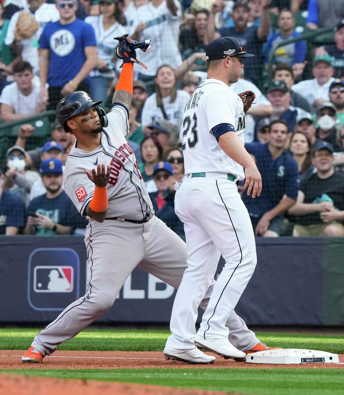 Houston Astros’ Martin Maldonado doesn’t get back to the back in time after Seattle Mariners first baseman Ty France catches a pop fly by Jose Altuve for a double play during the fifth inning of Game 3 of the American League Division Series on Saturday, Oct. 15, 2022, in Seattle.