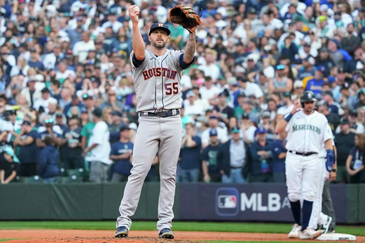 Houston Astros relief pitcher Ryan Pressly stands on the mound after giving up a single by Seattle Mariners Eugenio Suarez during the ninth inning of Game 3 of the American League Division Series on Saturday, Oct. 15, 2022, in Seattle.