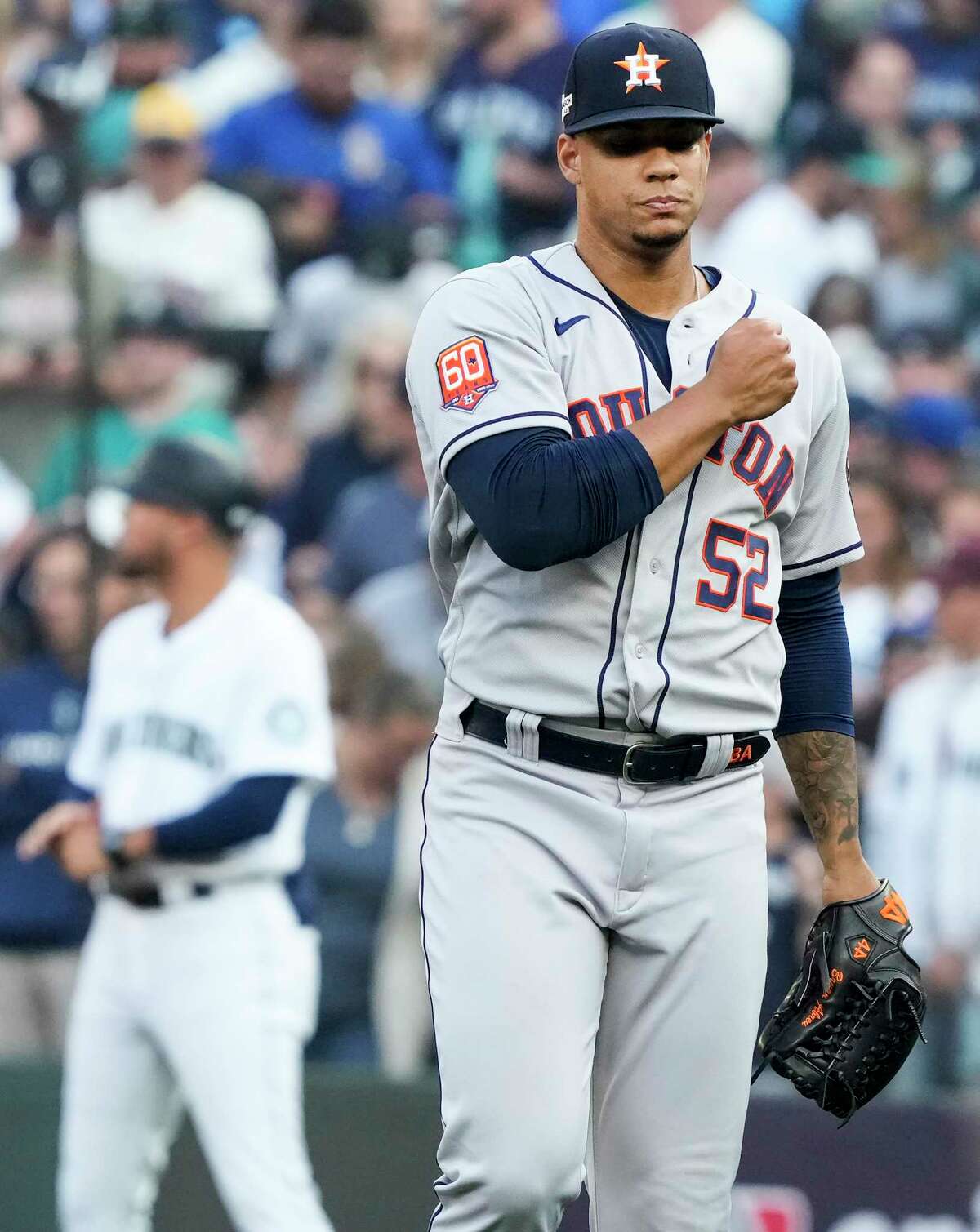 Houston Astros relief pitcher Bryan Abreu (52) reacts after getting Seattle Mariners center fielder Julio Rodriguez to fly out to first baseman Yuli Gurriel to end the 10th inning of Game 3 of the American League Division Series on Saturday, Oct. 15, 2022, in Seattle.