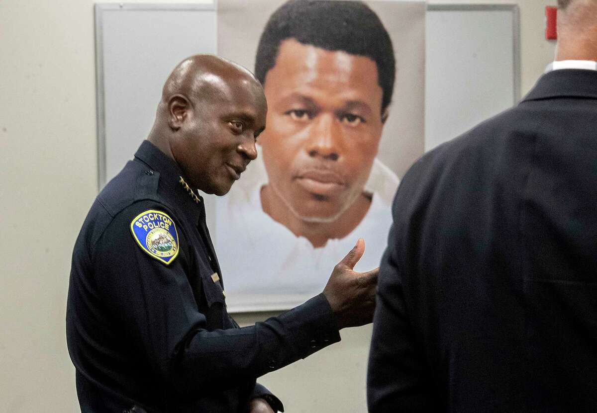 Stockton Police Chief Stanley McFadden speaks during a property   league  astatine  the Stockton Police Department office  successful  Stockton, Calif., connected  the apprehension  of fishy  Wesley Brownlee, representation   shown successful  background, in the Stockton serial killings connected  Saturday, Oct. 15, 2022. Behind McFadden is simply a booking photograph  of Brownlee. (Clifford Oto/The Record via AP)