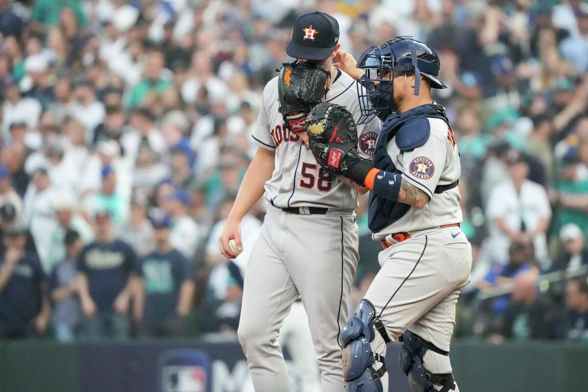 Houston Astros Christian Vazquez comes to the mound to talk to relief pitcher Hunter Brown during the 13th inning of Game 3 of the American League Division Series on Saturday, Oct. 15, 2022, in Seattle.