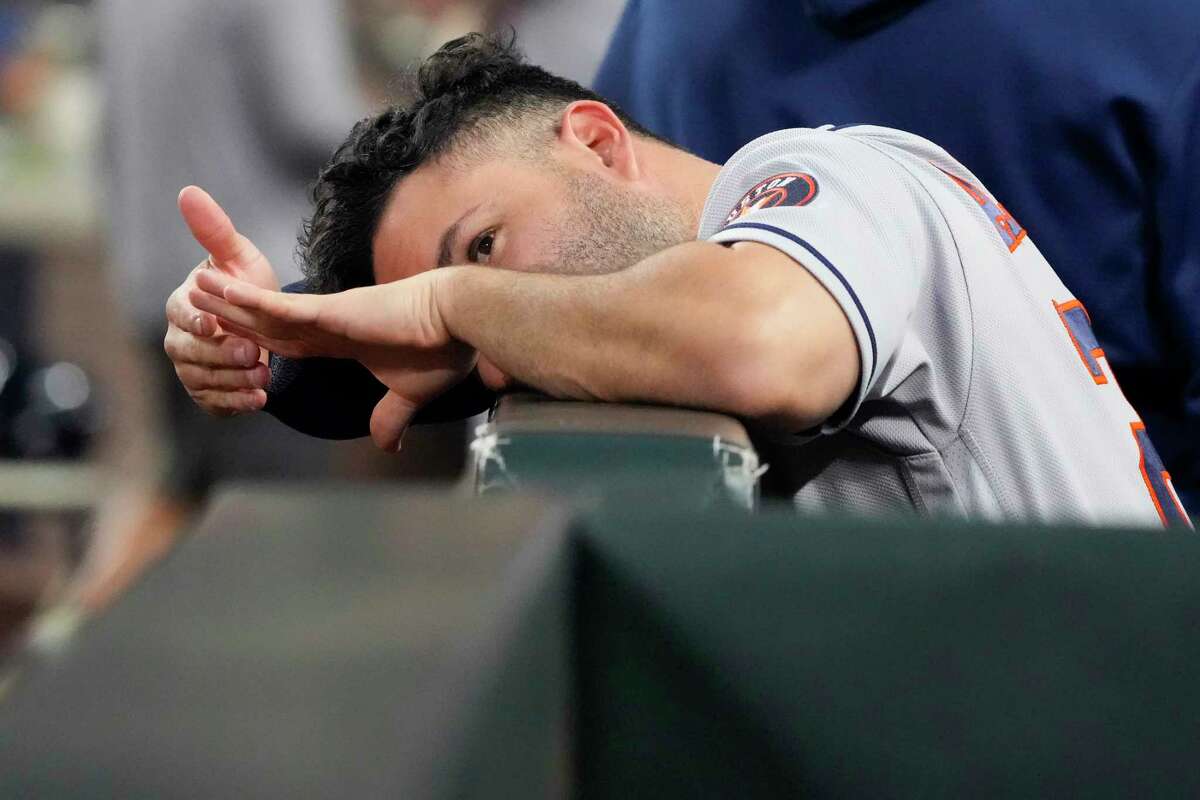 Houston Astros second baseman Jose Altuve stands in the dugout before the start of the 16th inning of Game 3 of the American League Division Series against the Seattle Mariners on Saturday, Oct. 15, 2022, in Seattle.
