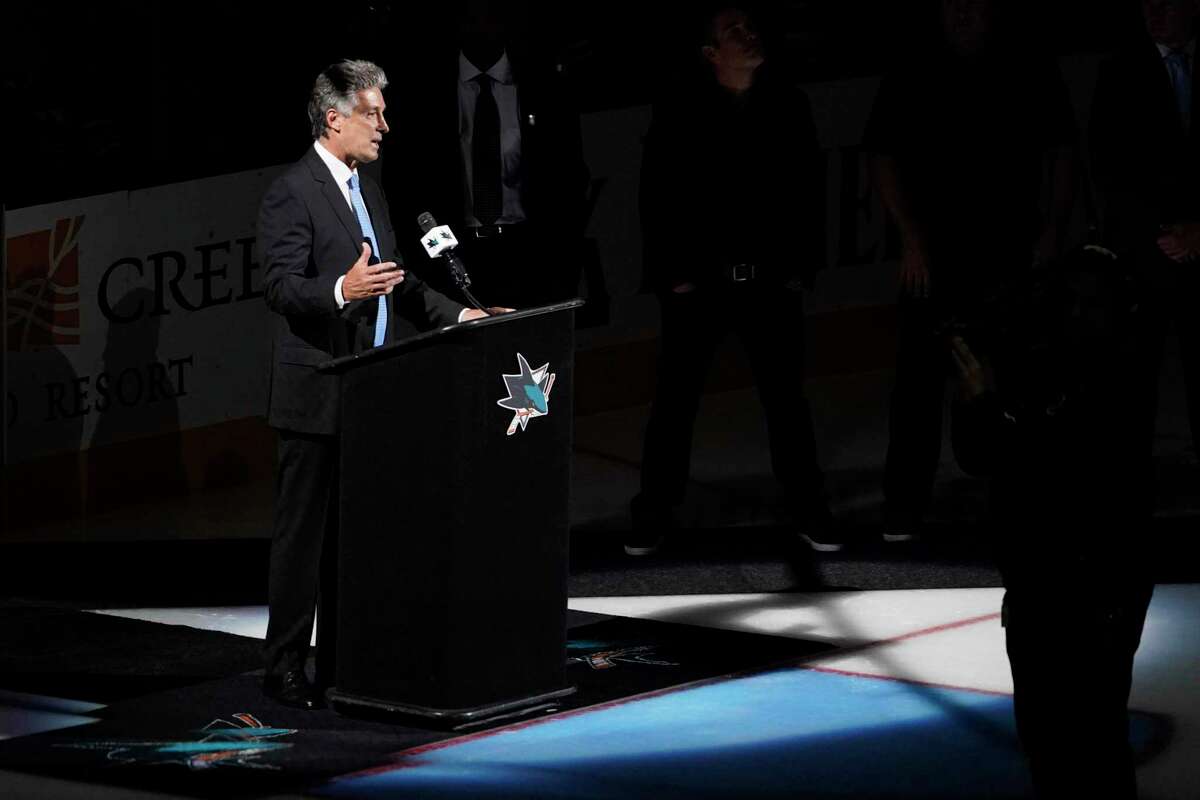 Former San Jose Sharks player and general manager Doug Wilson speaks to the crowd during a ceremony to unveil a banner in his honor, before the team's NHL hockey against Chicago Blackhawks in San Jose, Calif., Saturday, Oct. 15, 2022. (AP Photo/Godofredo A. Vásquez)