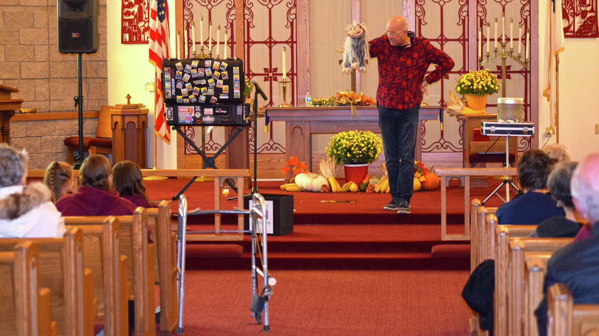 Magician Tim Hanning and his puppet, Oscar T. Possum, perform for members of Centenary United Methodist Church as a part of the church's celebration of its 200th anniversary.