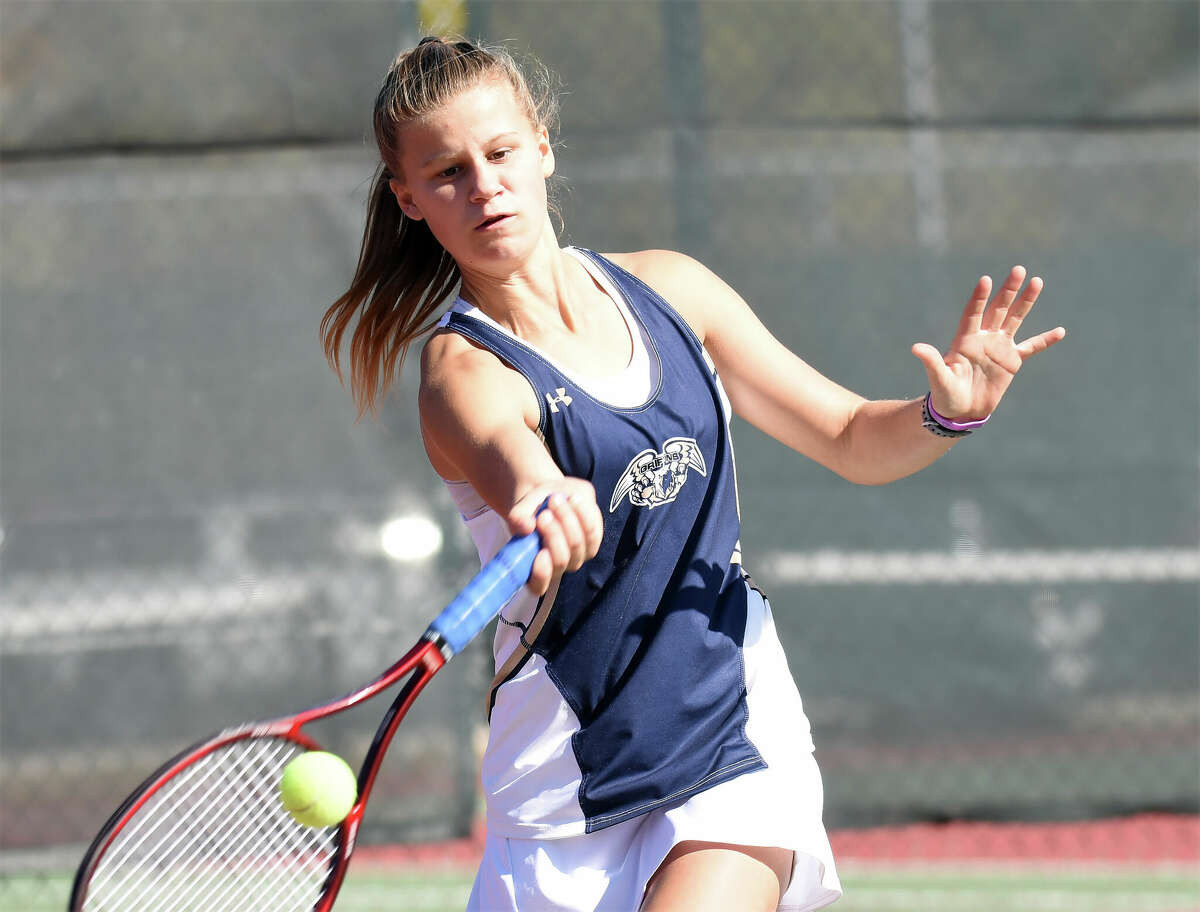 Father McGivney's Natalie Beck hits a forehand shot during the third-place match of the Class 1A Triad Sectional on Saturday in Troy.