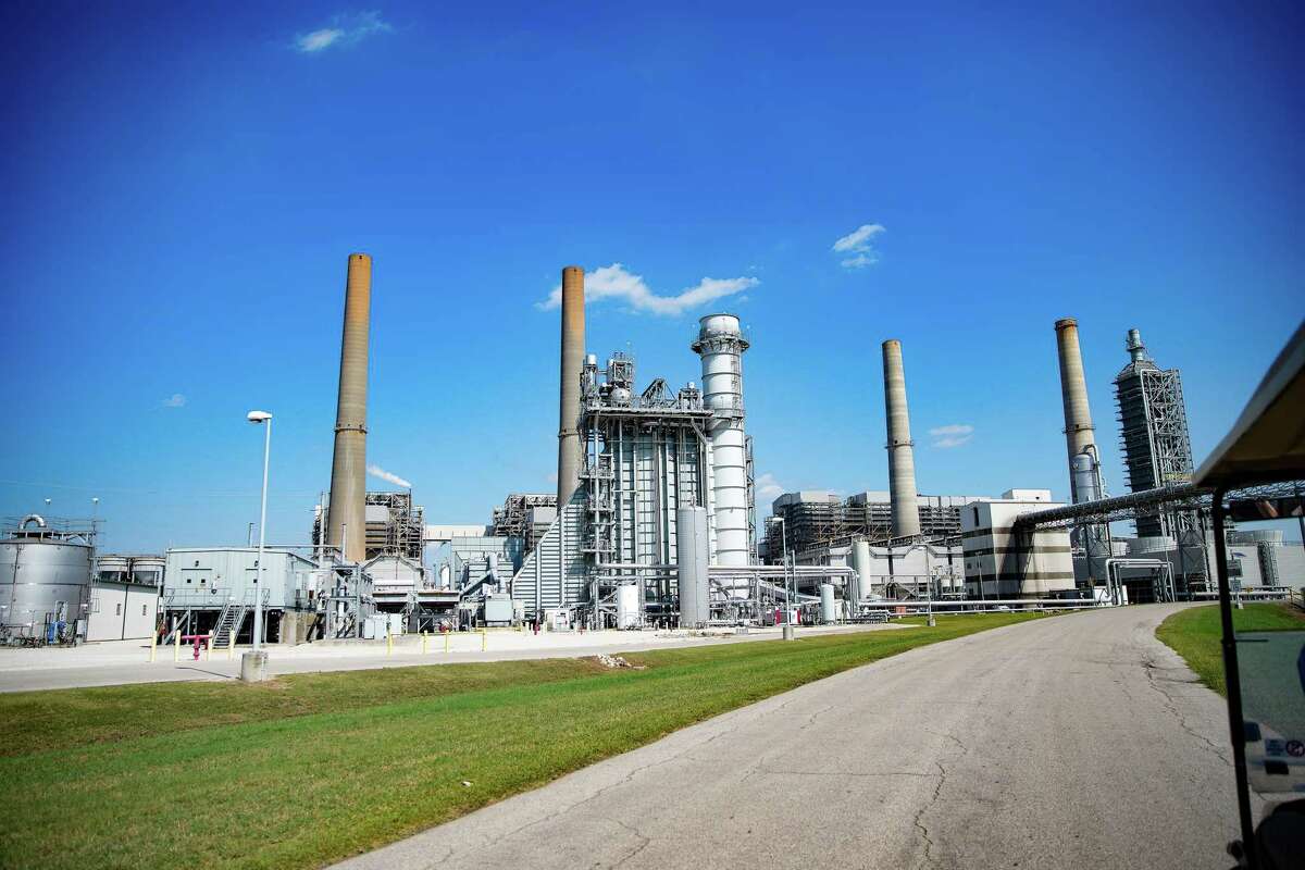 The coal-burning power plants stand behind the Petra Nova Carbon Capture plant at NRG’s WA Parish power plant on Friday, Oct. 14, 2022 in Richmond.