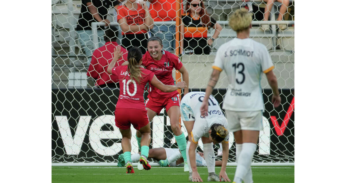 Kansas City Current defender Kate Del Fava (8) celebrates her 100th minute goal during the second half of the National Women's Soccer League quarter final playoff match against the Houston Dash Sunday, Oct. 16, 2022, at PNC Stadium in Houston. Kansas City Current defeated Houston Dash 2-1 in stoppage time.