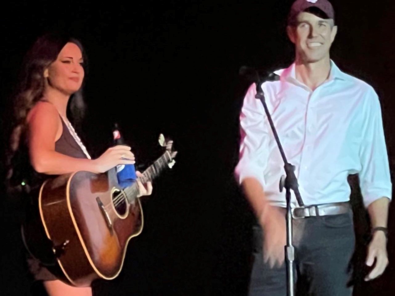 Kacey Musgraves grabs a beer from Beto O'Rourke on ACL Fest stage