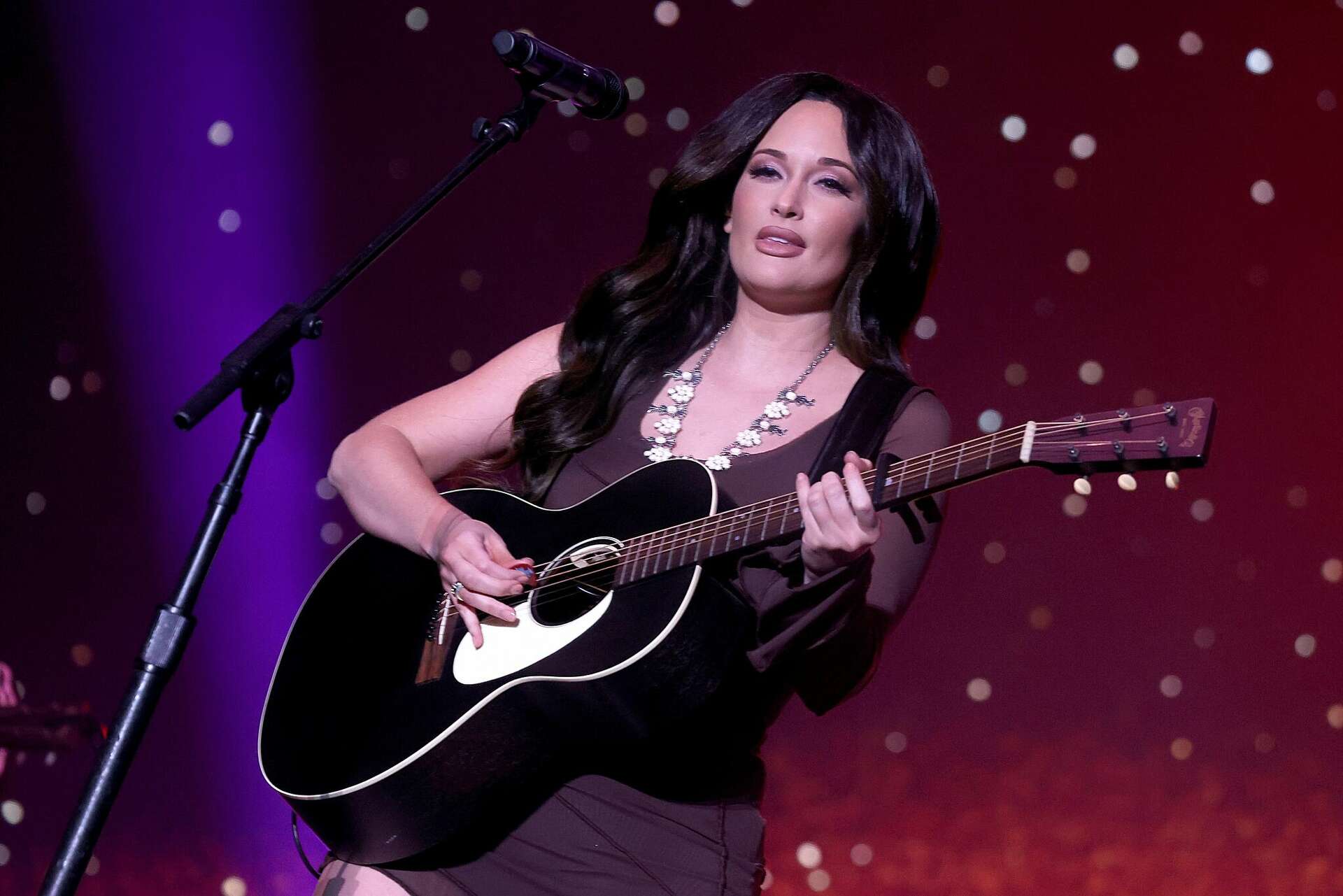 Kacey Musgraves grabs a beer from Beto O'Rourke on ACL Fest stage