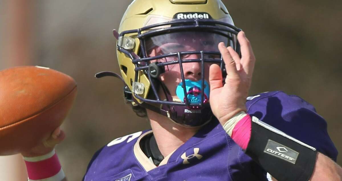 Routt senior quarterback Kohen Hoots looks for a receiver during a football game against West Central at the old MacMurray College football field in Jacksonville on Saturday.