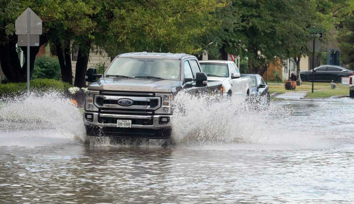Cars make their way down a flooded D Street, between Midland High and Cuthbert Ave. 09/17/2022 after overnight rains saturated Midland. Tim Fischer/Reporter-Telegram