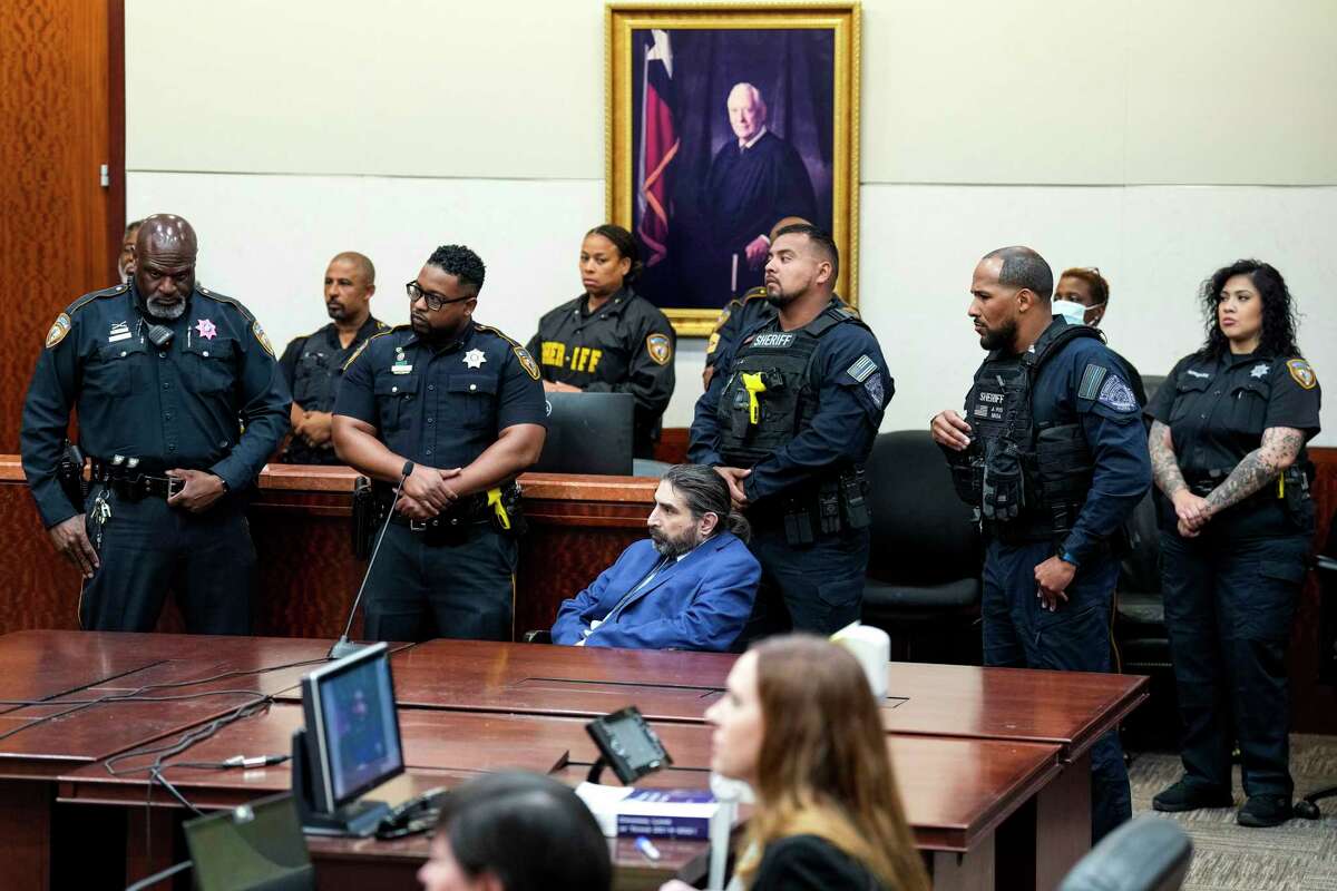 Robert Solis sits at the defense table, surrounded by law enforcement officers, after he was found guilty of capital murder in the September 2019, shooting death of Harris County Sheriff's Office Deputy Sandeep Dhaliwal, Monday, Oct. 17, 2022 in Houston. Solis represented himself in the case that carries the death penalty. The guilty verdict came back in about 25 minutes.