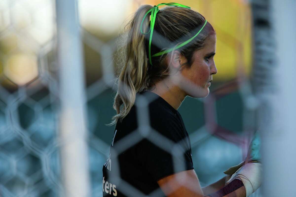 Stanford goalie Ryan Campbell practices with her teammates prior to their game against UCLA at Maloney Field at Cagan Stadium on Friday, October 14, 2022, in Stanford, Calif.