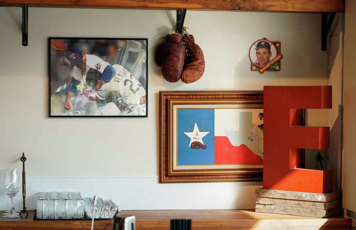 A corner dedicated to former baseball player Nolan Ryan is displayed at EZ's Liquor Lounge.